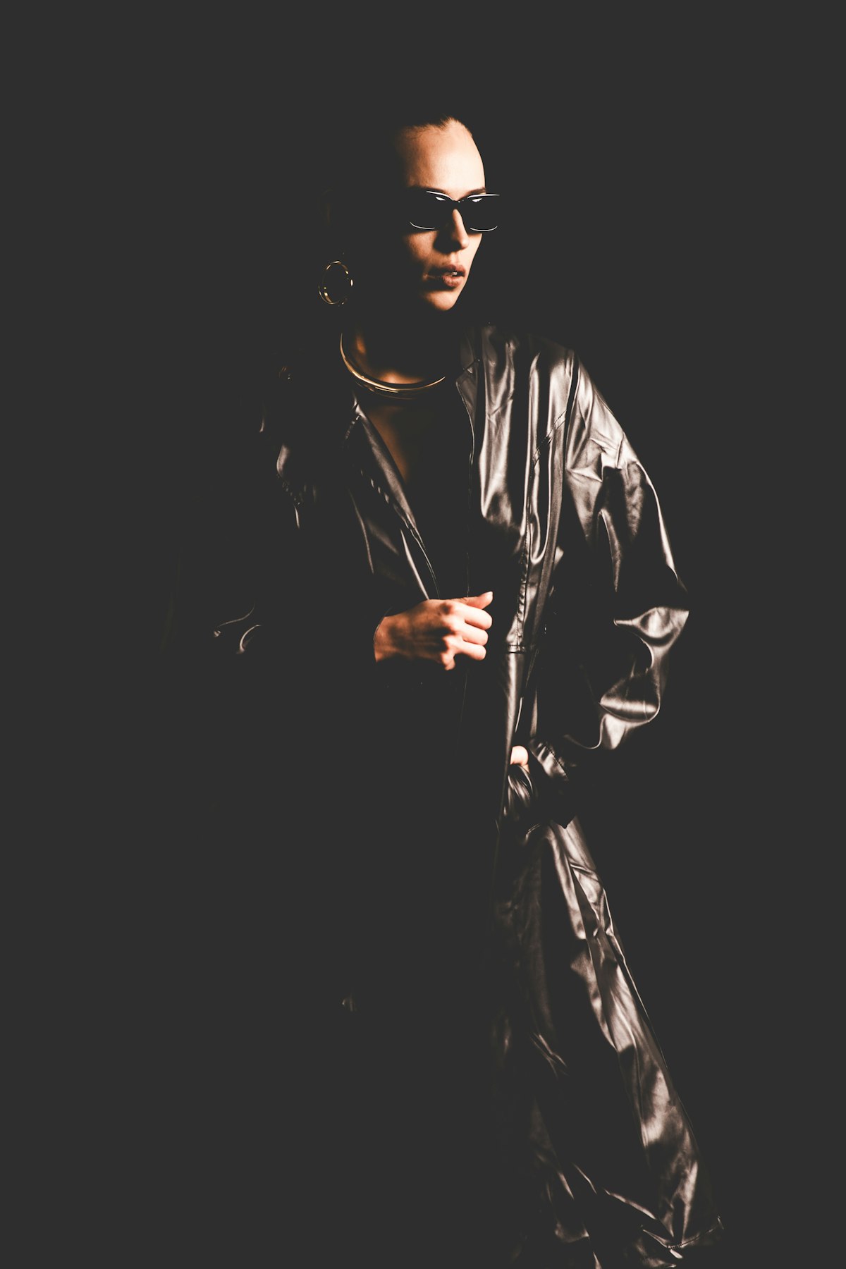 Stylish person in leather and sunglasses